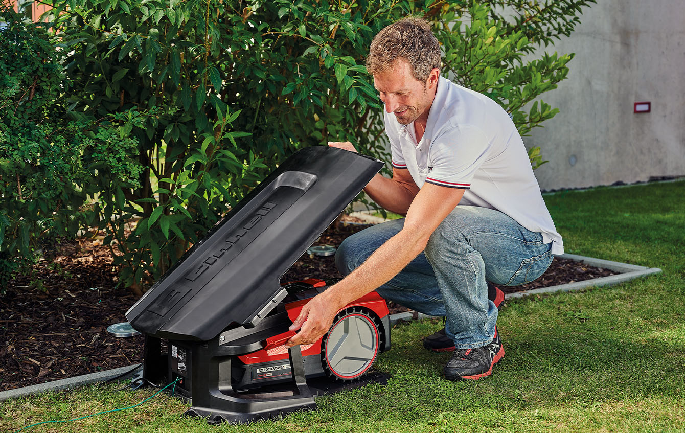 a Einhell robot mower in his garage