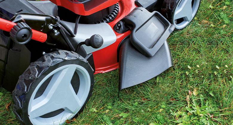 The side discharge of a cordless lawnmower.