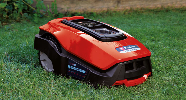 Close-up of a red and black robotic lawnmower from Einhell.