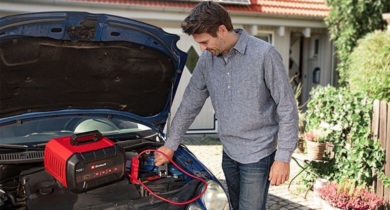 man working with a battery charger