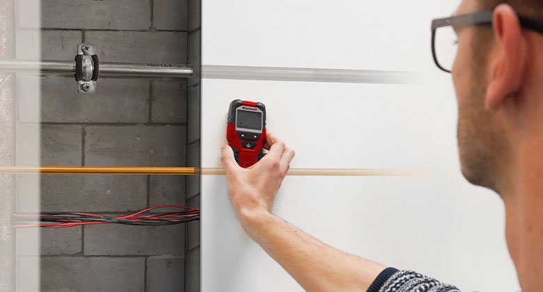 man using a digital detector