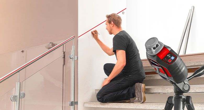 a man using a measuring tool